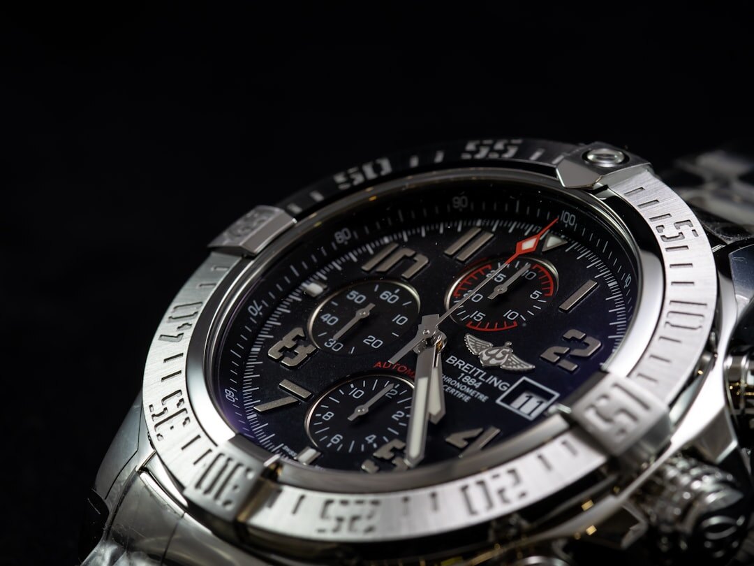 Studio product photograph of a stainless steel luxury chronograph watch
